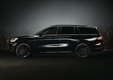 A 2024 Lincoln Aviator® SUV is shown in the Infinite Black exterior color | Parkway Lincoln in Dover OH