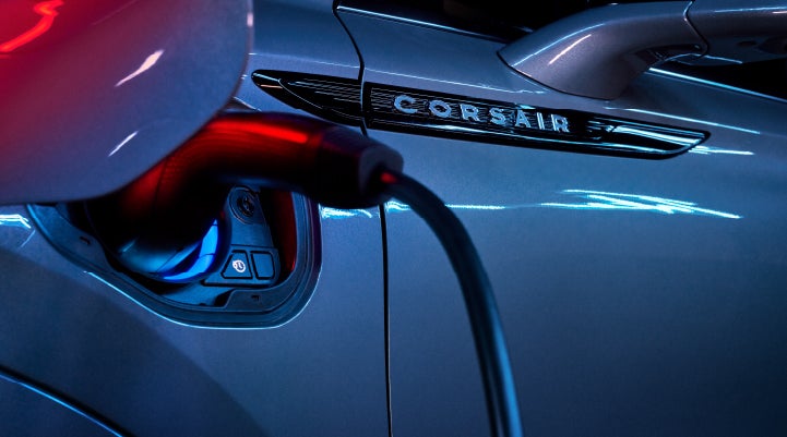 A charger plugged into the charging port of a 2024 Lincoln Corsair® Plug-in Hybrid model. | Parkway Lincoln in Dover OH
