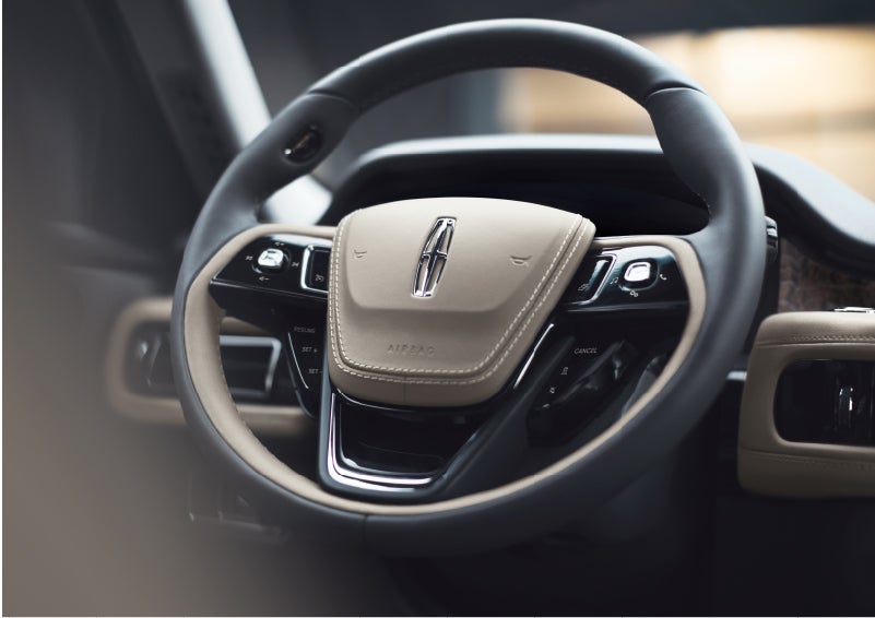 The intuitively placed controls of the steering wheel on a 2023 Lincoln Aviator® SUV | Parkway Lincoln in Dover OH