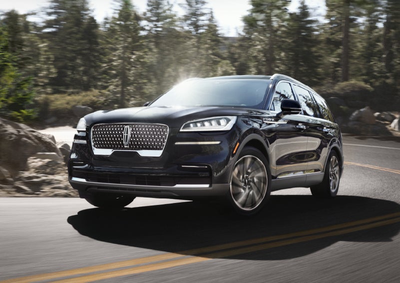 A Lincoln Aviator® SUV is being driven on a winding mountain road | Parkway Lincoln in Dover OH